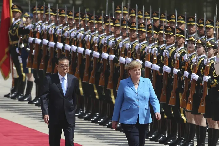 Меркел от Пекин: Германия и Китай подкрепят Иран